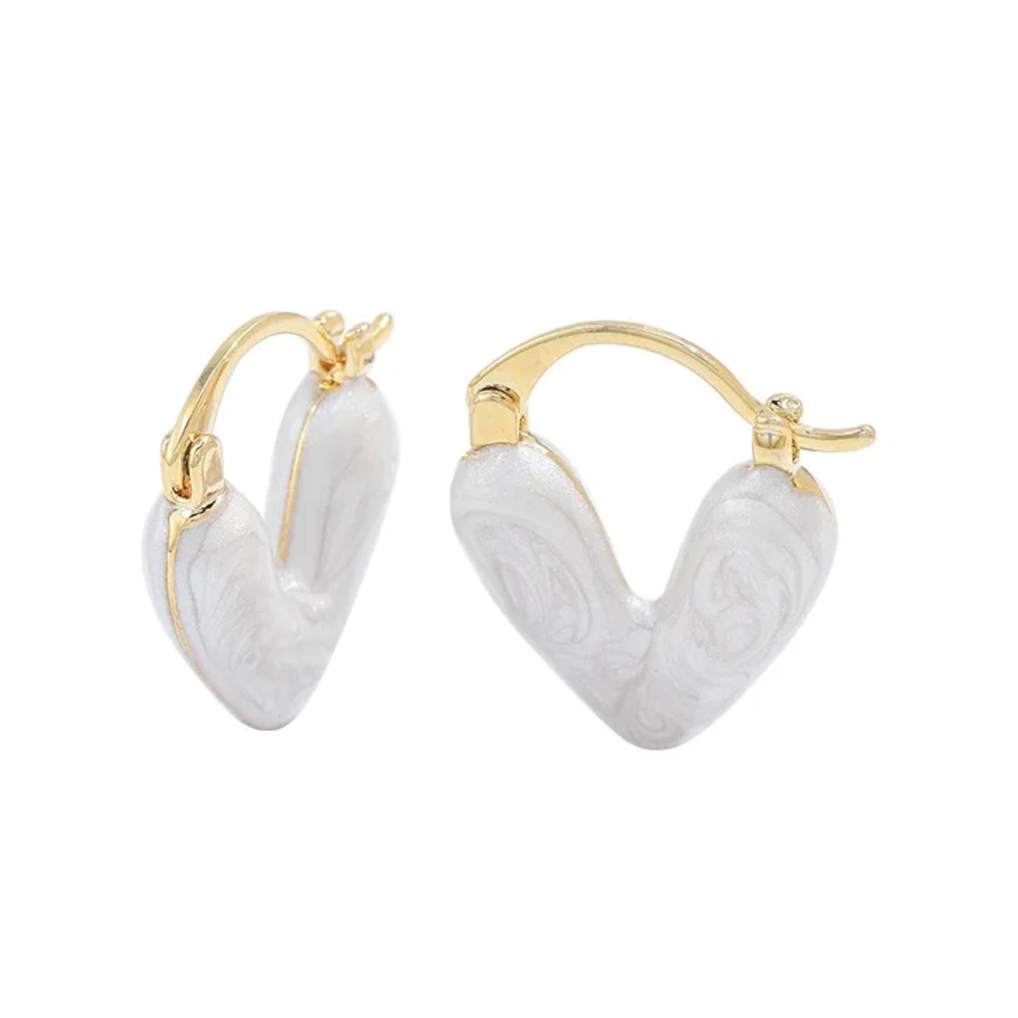 A pair of white heart-shaped hoop earrings with gold accents on the hoop closures.