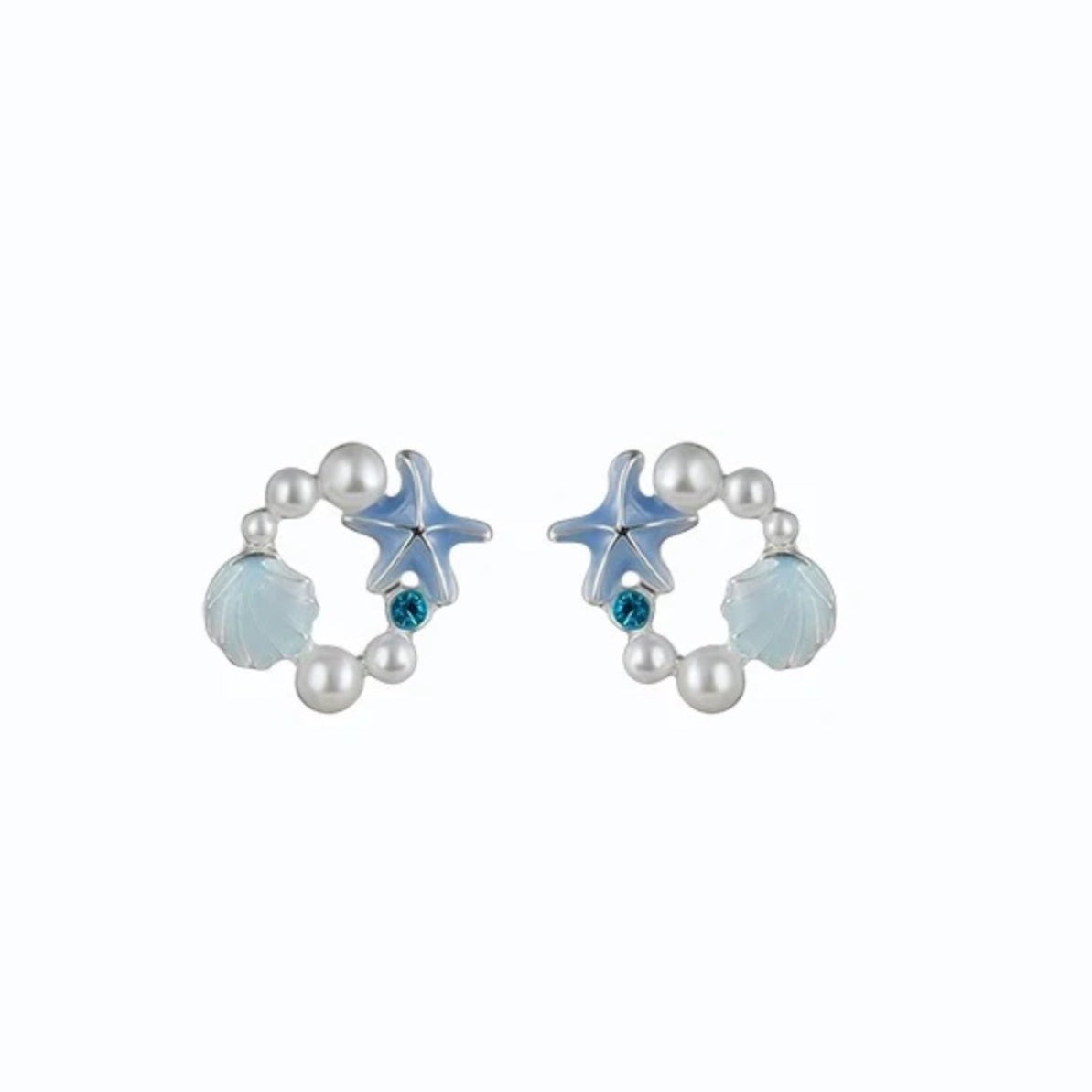 A pair of silver-colored pearl earrings featuring starfish and seashell designs, with blue and green accents.