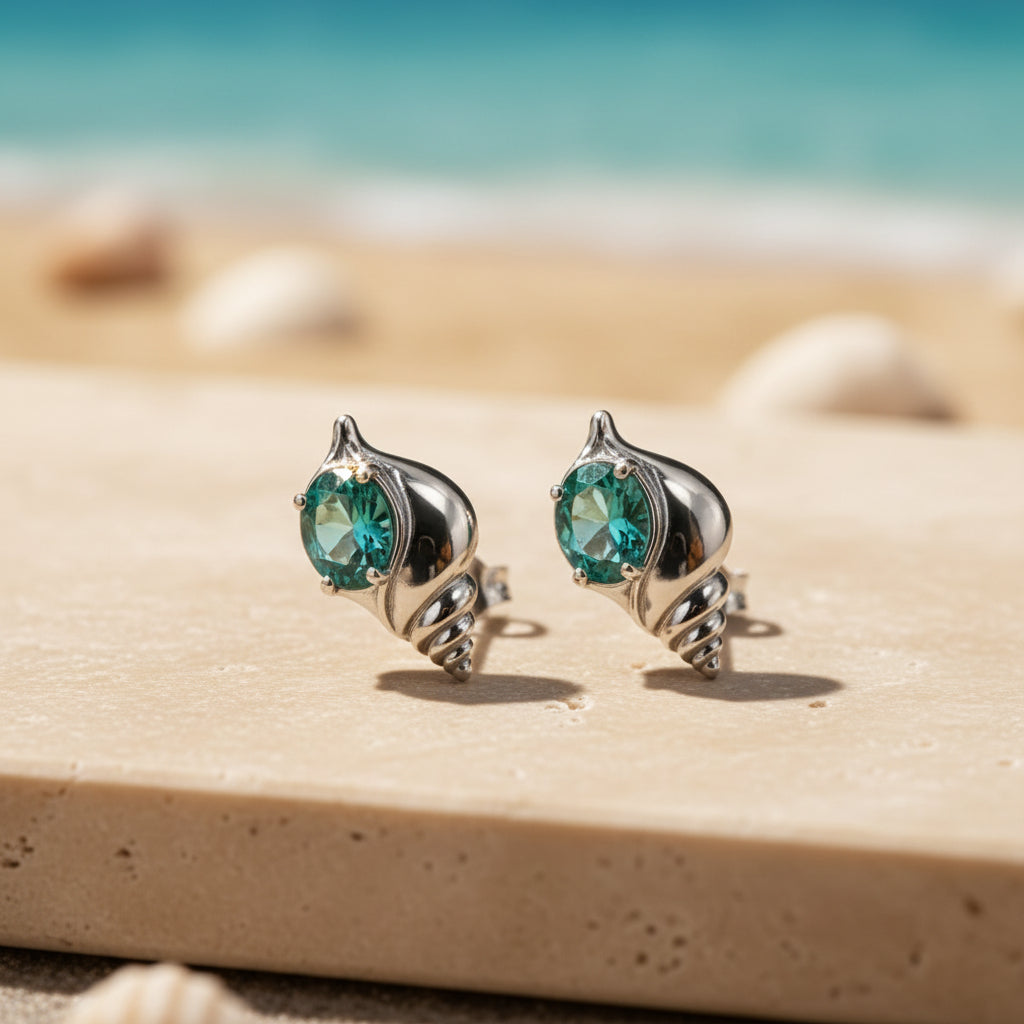 Aqua Gem Seashell Earrings on beige travertine