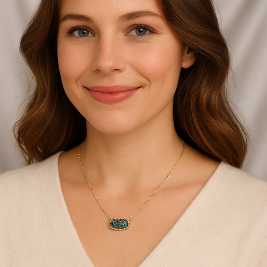 Woman wearing a Blue Druzy Oval Pendant Gold Necklace against a neutral background