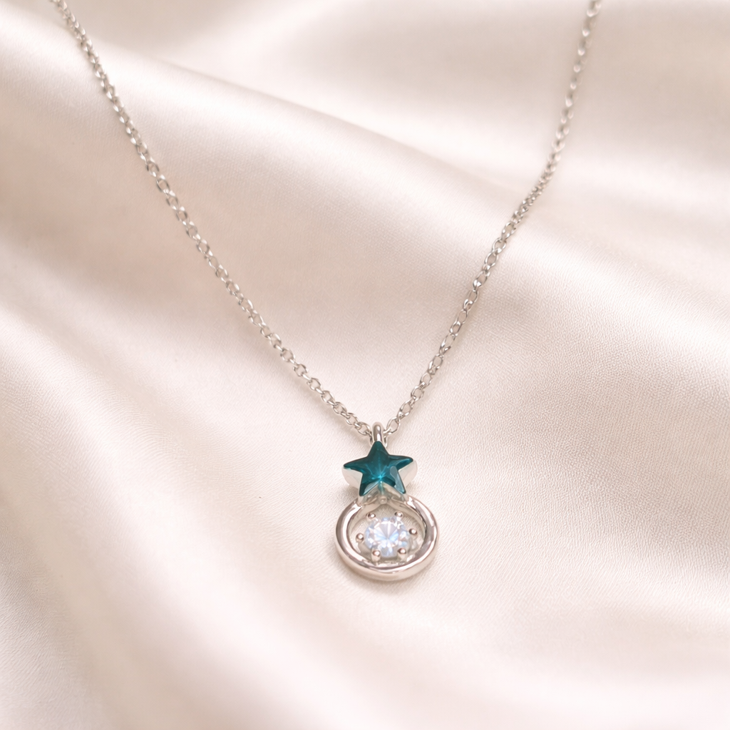 Midnight Star Halo Necklace with a star-shaped pendant on a soft pink background