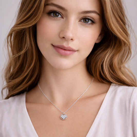 Woman wearing a Rhinestone Circle Heart Necklace with a heart pendant against a neutral background