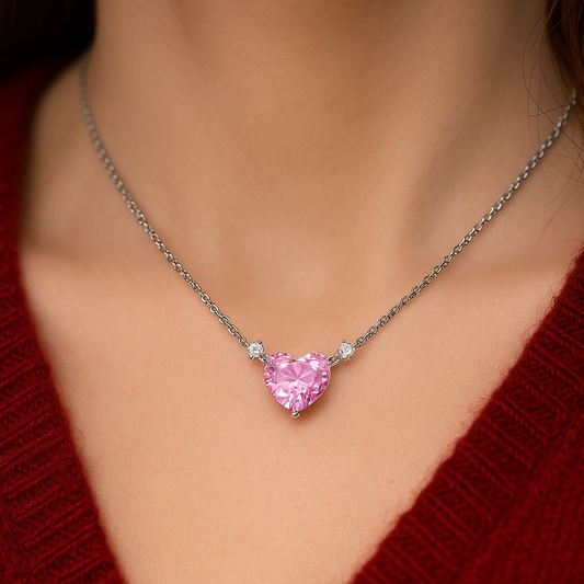 Pink Zirconia Heart Necklace on a person wearing a red sweater.