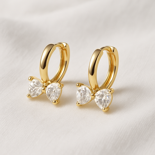 Gold Zircon Bow Hoop Earrings on a light background