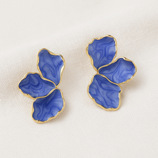 Blue Marble Petal Earrings on a white cloth background