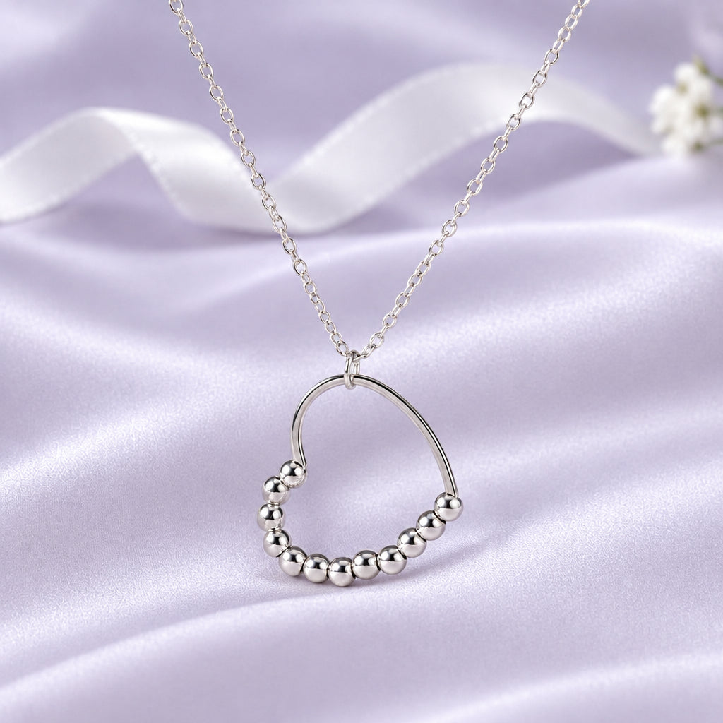 Silver Beaded Heart Spinner Necklace