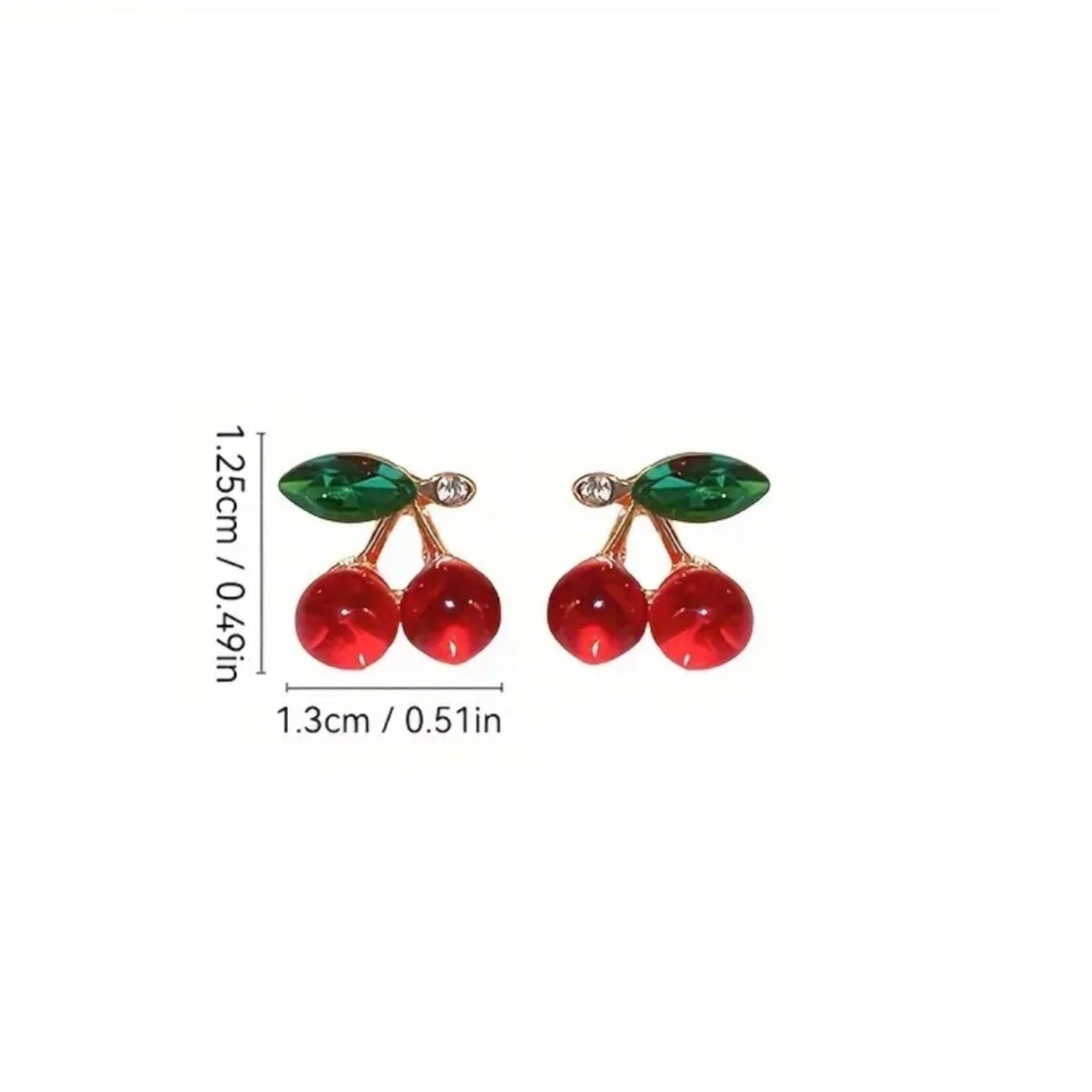 Cherry-themed earrings with red stones and green leaves on a white background.