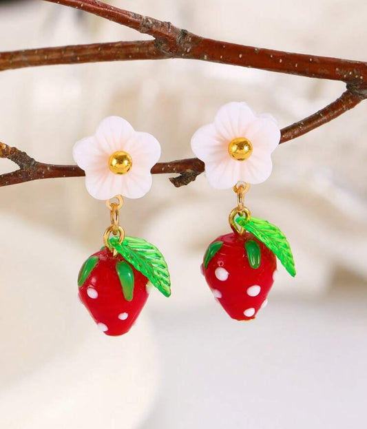 Gold-tone strawberry earrings with red enamel and white flower detail on stud posts