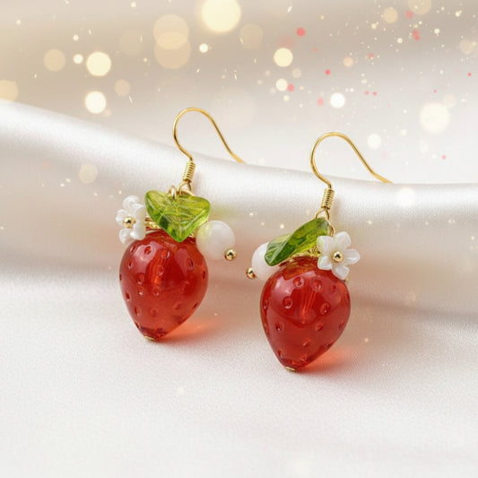 Strawberry Flower Earrings with gold hooks on a white surface