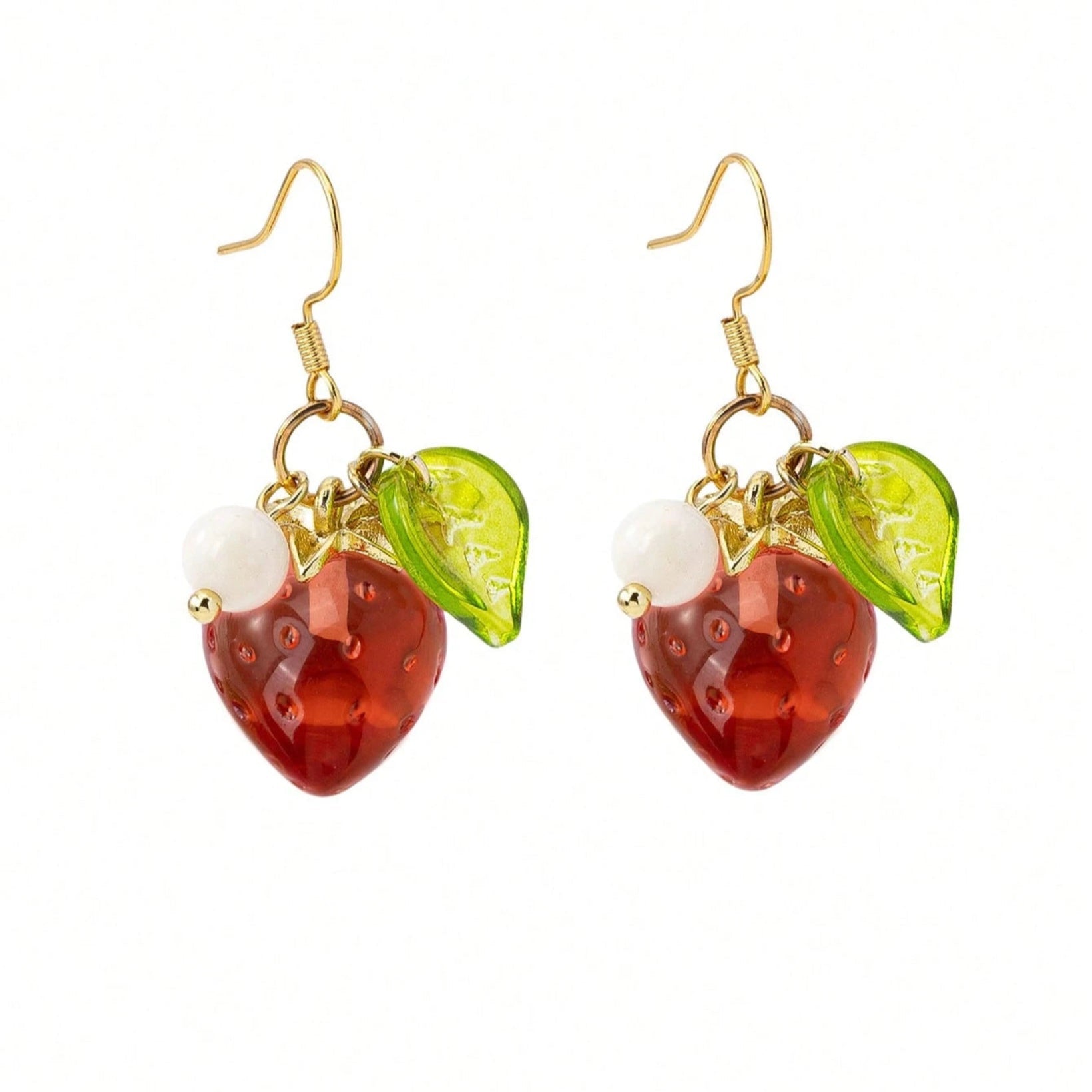 Strawberry-themed earrings with gold hooks on a white background