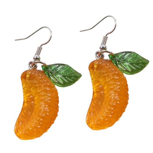 Orange-shaped earrings with green leaves on a white background