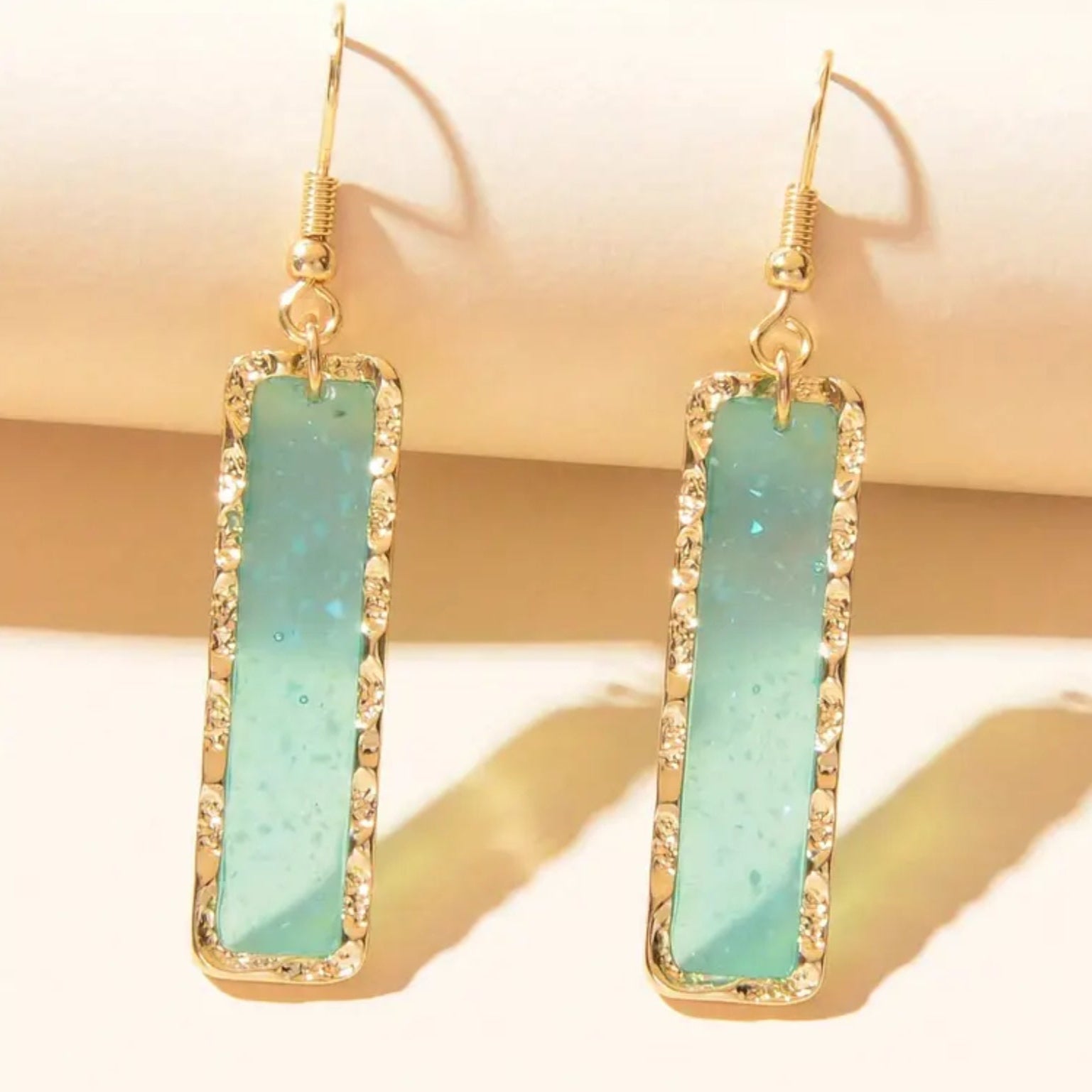 Ocean Mist Sea Glass Earrings on a beige background