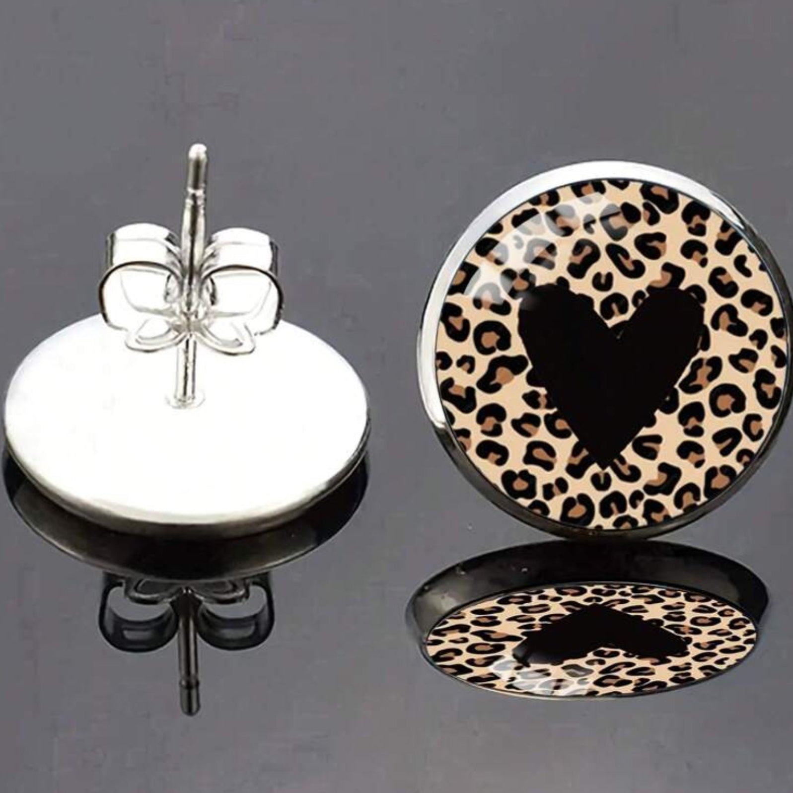 Leopard print heart-shaped earring on a gray background