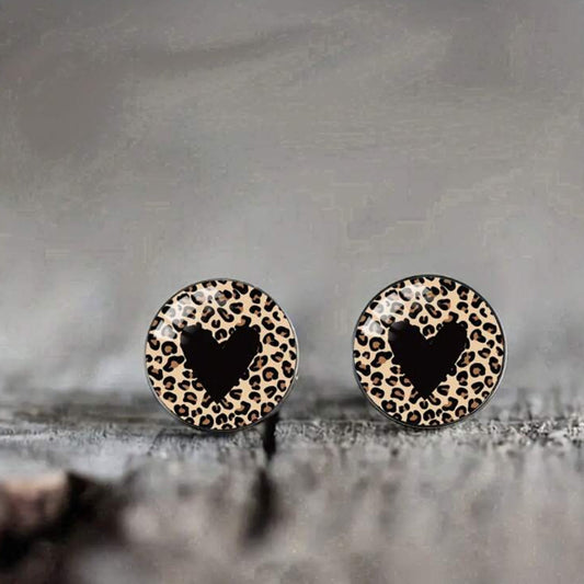Gold stud earrings with leopard print heart-shaped enamel design