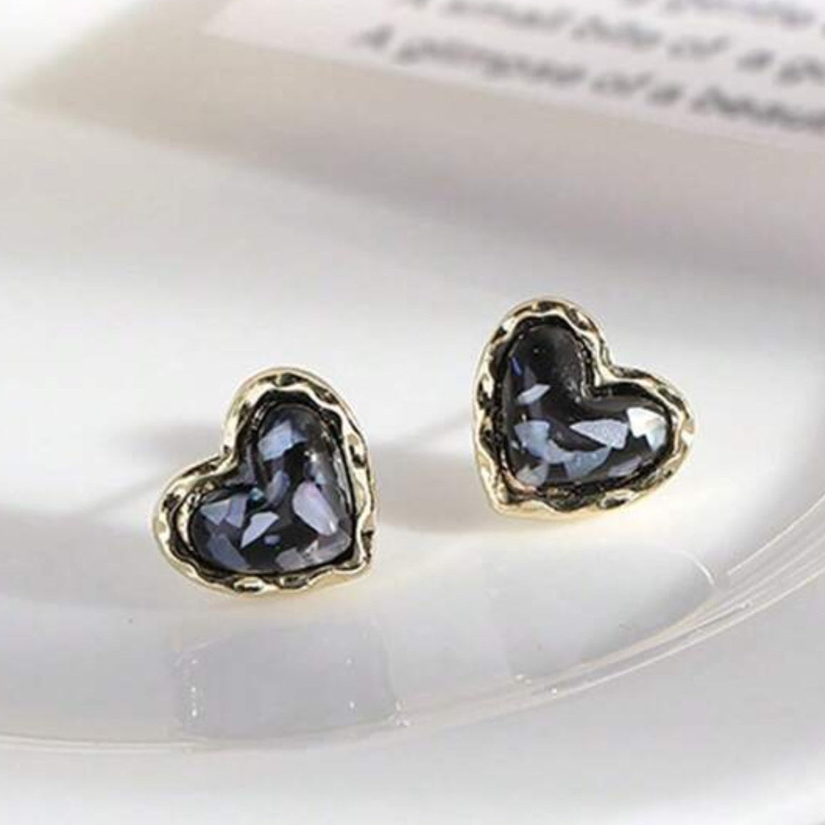 Midnight Mosaic Gold Heart Studs on a light surface