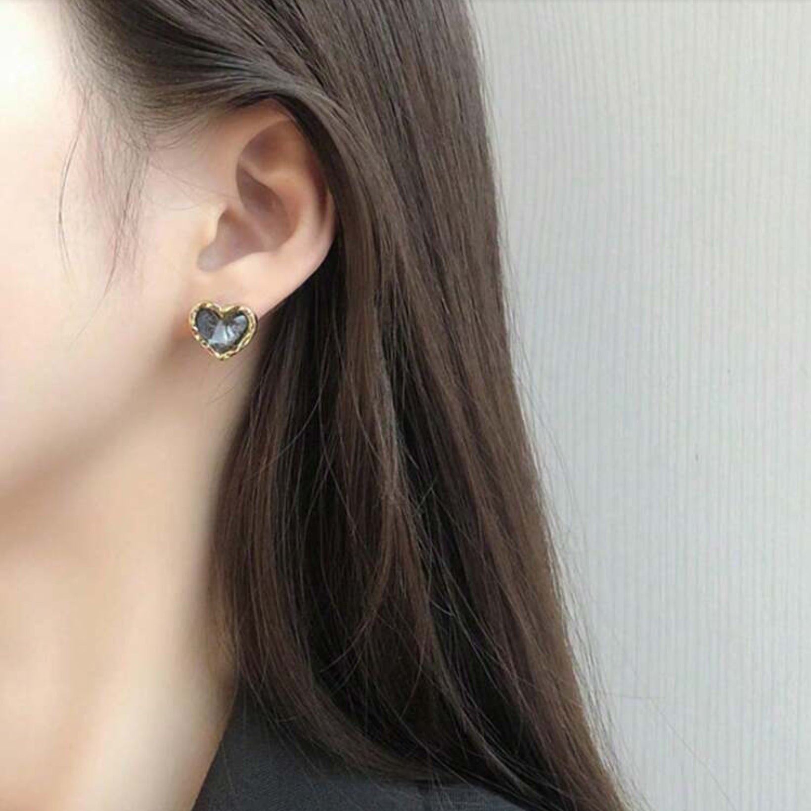 Midnight Mosaic Gold Heart Studs worn by a person with long hair against a neutral background