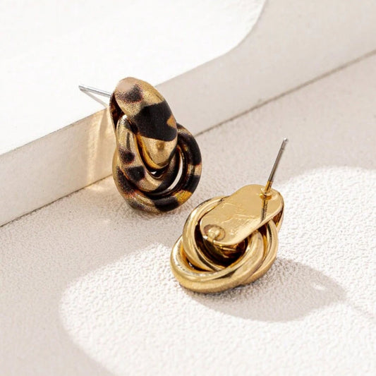 Pair of Leopard Circle Knot Earrings on a white surface