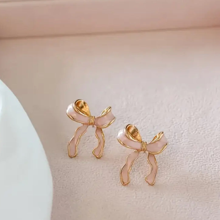 Pink Bow Earrings displayed against a light background.