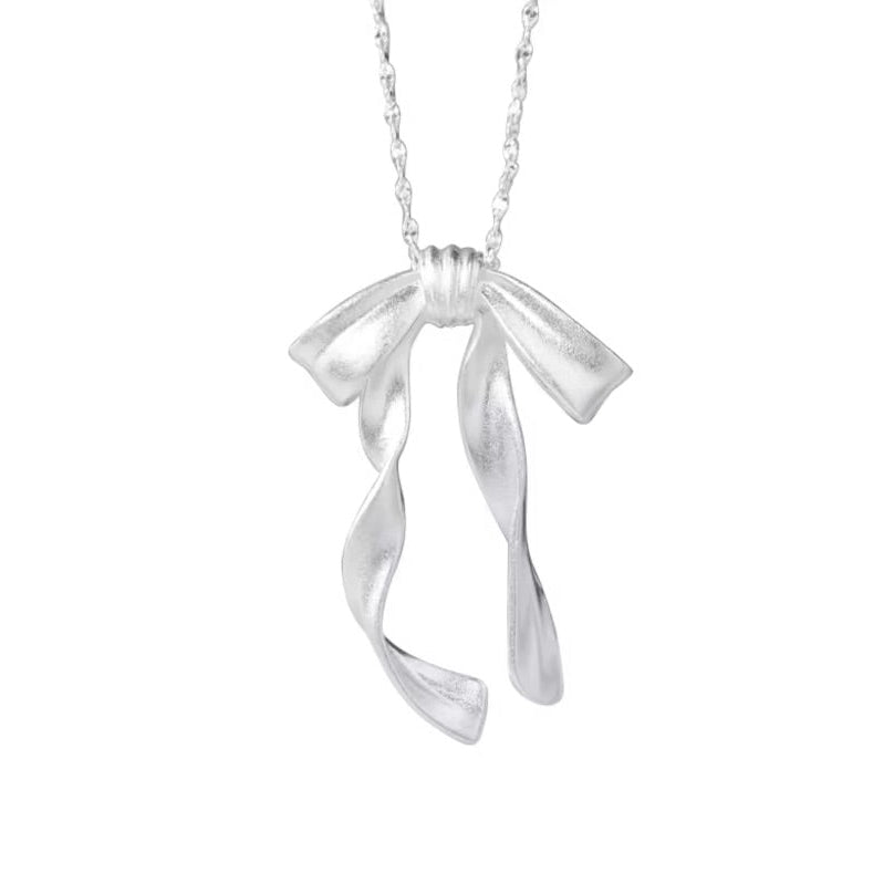 Silver Ribbon Bow Necklace against a white background