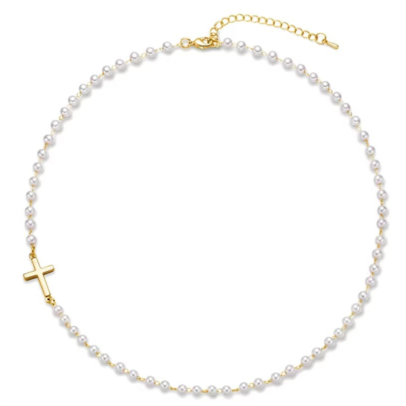 Gold Cross Pearl Necklace with a gold cross pendant on a white background
