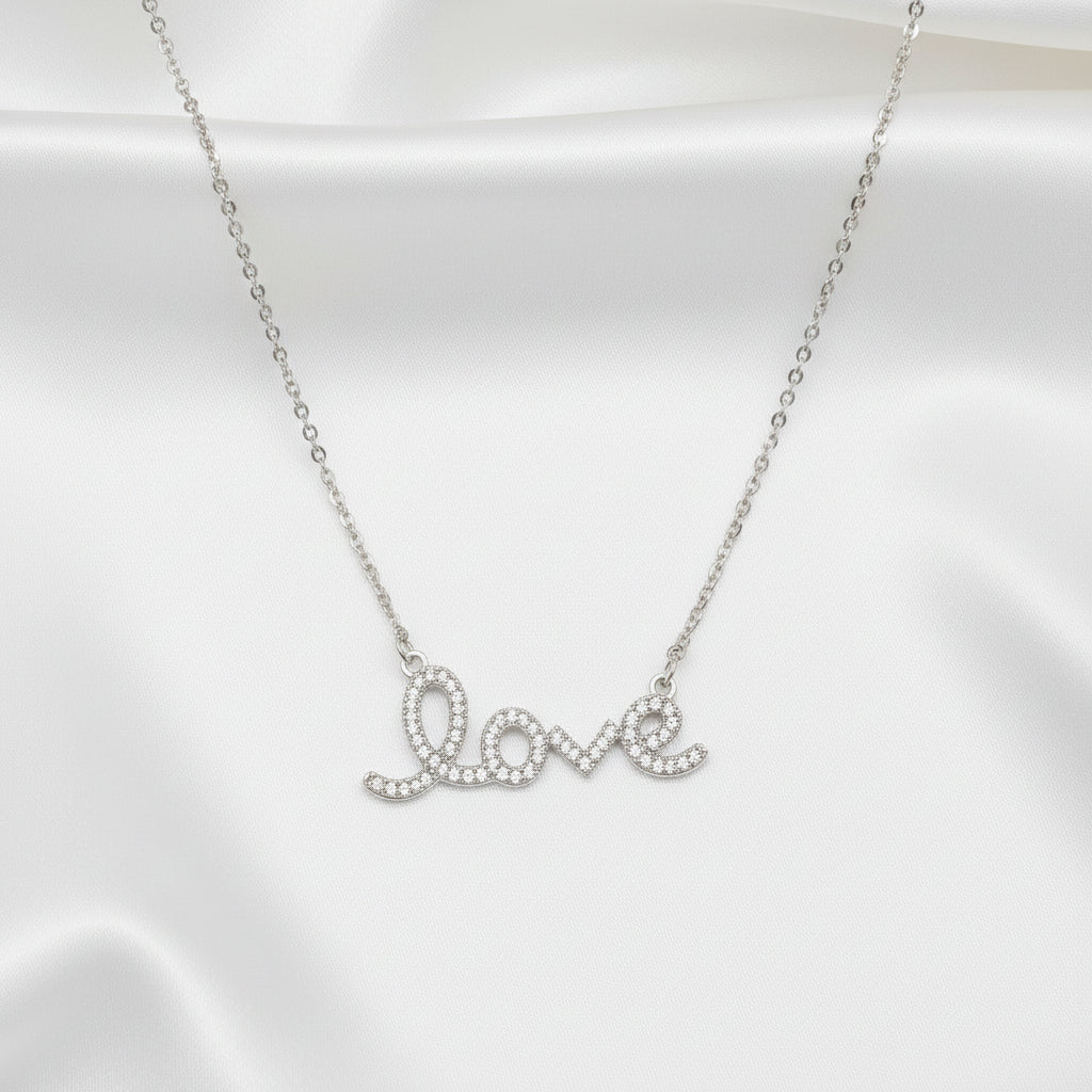 Love Script Rhinestone Necklace on satin background
