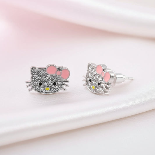 Pink Bow Kitty Pavé Earrings on a soft pink background
