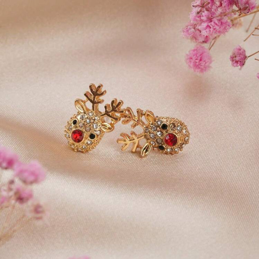 Rudolph Red Nose Reindeer Earrings on a soft pink background with pink flowers.