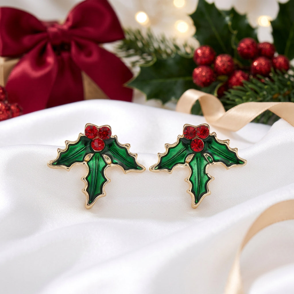 Red Berry Holly Earrings with red centers on a white surface.