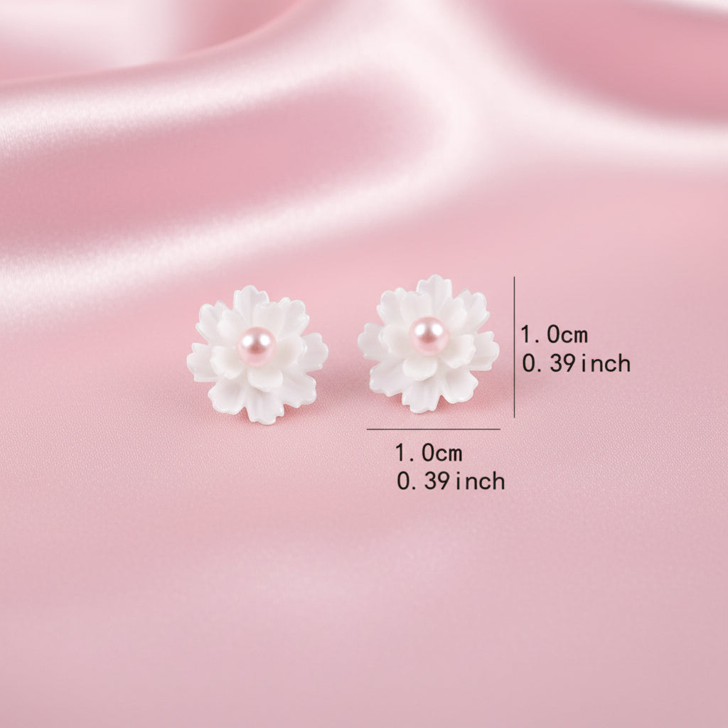 Flower-shaped earrings with measurements on a white background