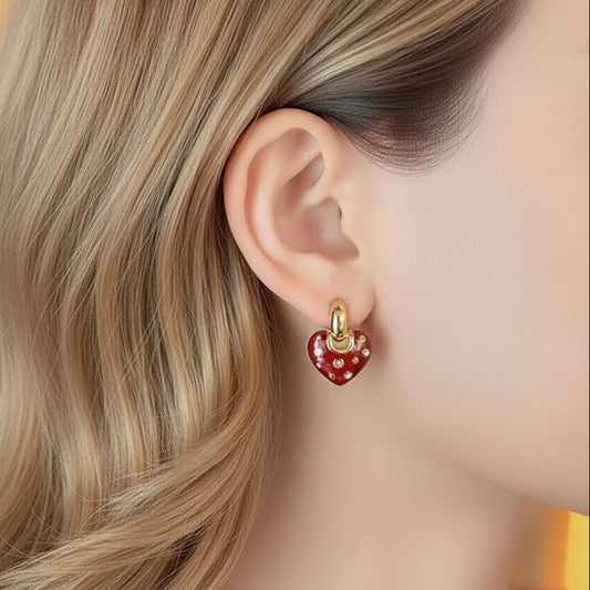 Close-up of a person wearing a Crystal Accent Red Heart Earring