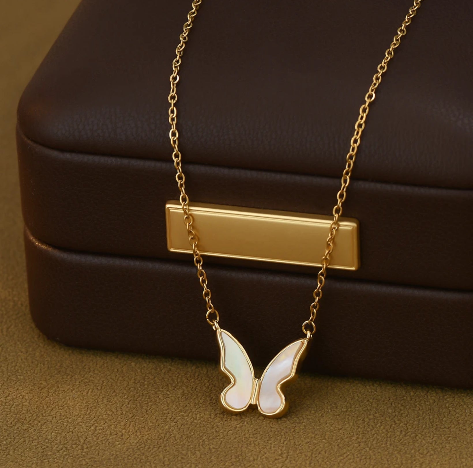 Elegant Shell Butterfly Necklace with a gold-plated adjustable chain (17-19"), perfect for everyday wear or special occasions.