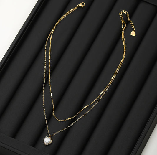 Close-up of the Layered Heart Zircon Necklace showing the intricate zircon details and elegant heart design.