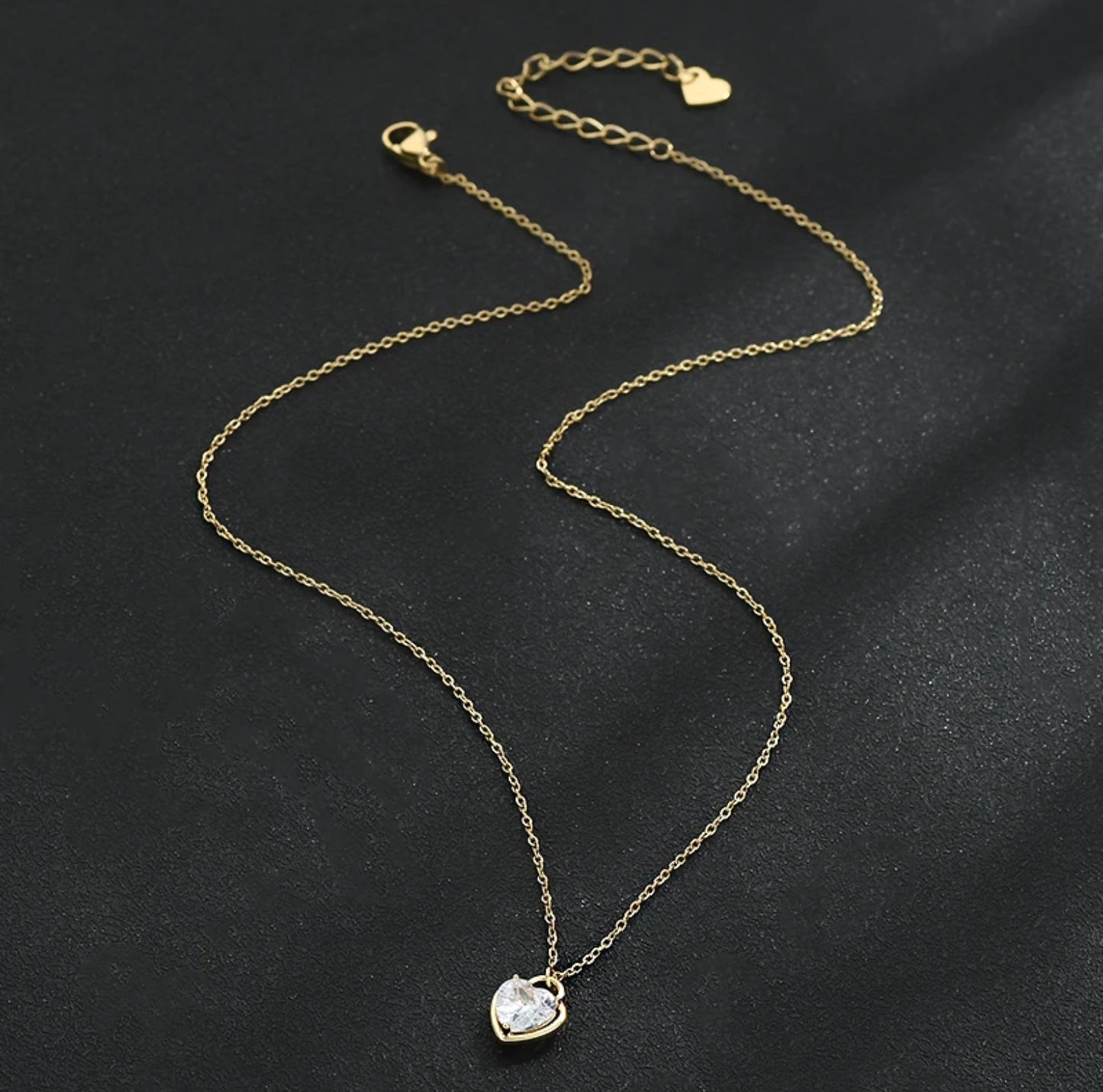 Zircon Heart Locket Necklace featuring a heart-shaped locket with sparkling zircons and an adjustable 16"-18" chain, showing full chain.