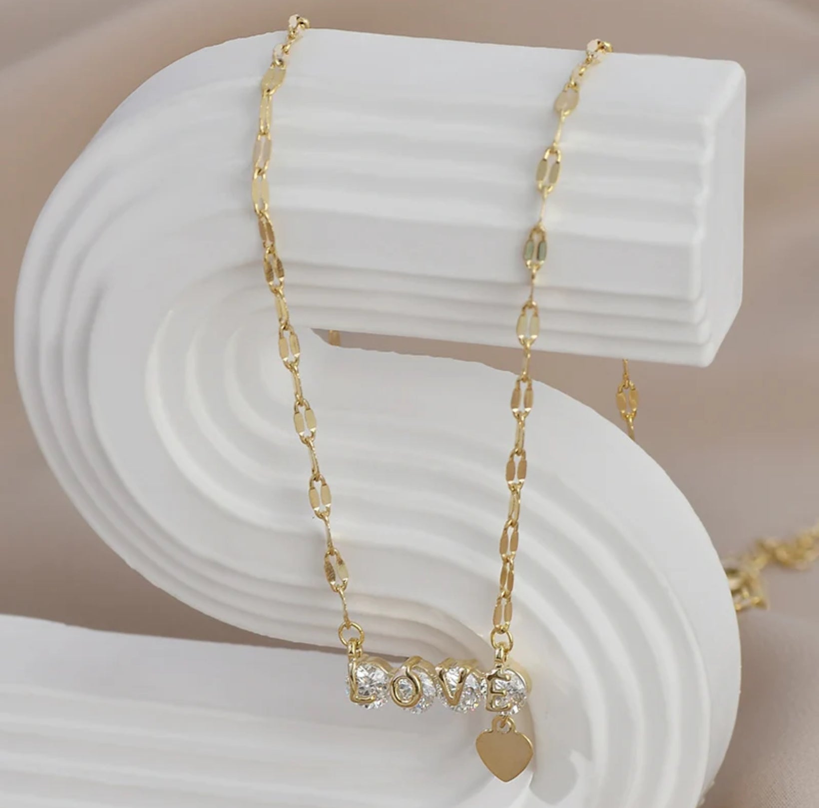 Close-up of the zircon heart pendant on the Zircon Love Heart Necklace, showcasing its elegant design, white S background.