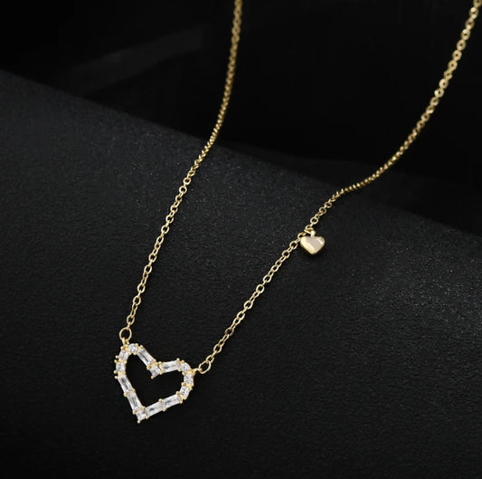 Close-up of the Zircon Gold Heart Necklace highlighting the radiant zircon details and gold finish.