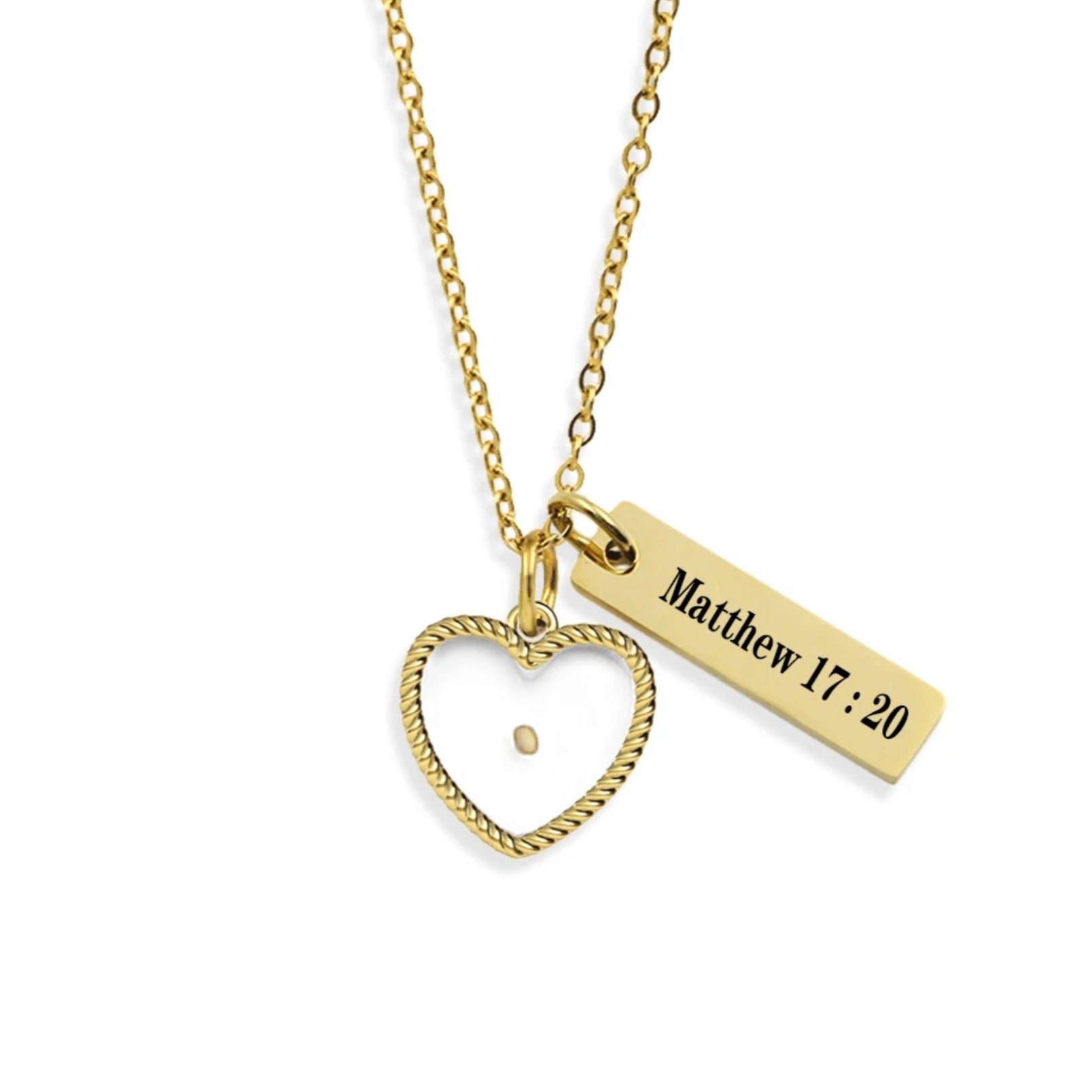 A gold-plated Mustard Seed Heart Necklace with an adjustable chain, a heart-shaped charm, and an engraved tag with Matthew 17:20.