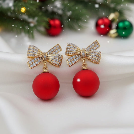 Red Ornament Pavé Bow Earrings on holiday background