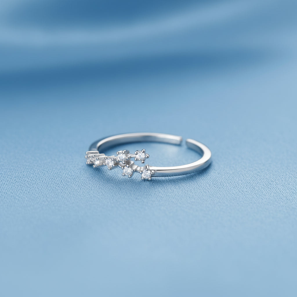 Silver Virgo Zodiac Ring on a light gray background
