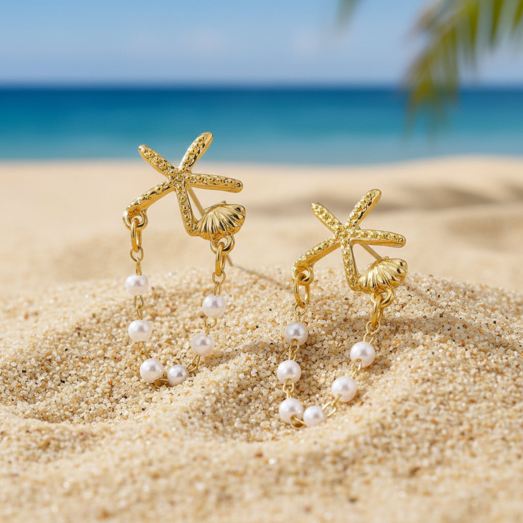 Starfish Shell Pearl Earrings on sand with ocean background