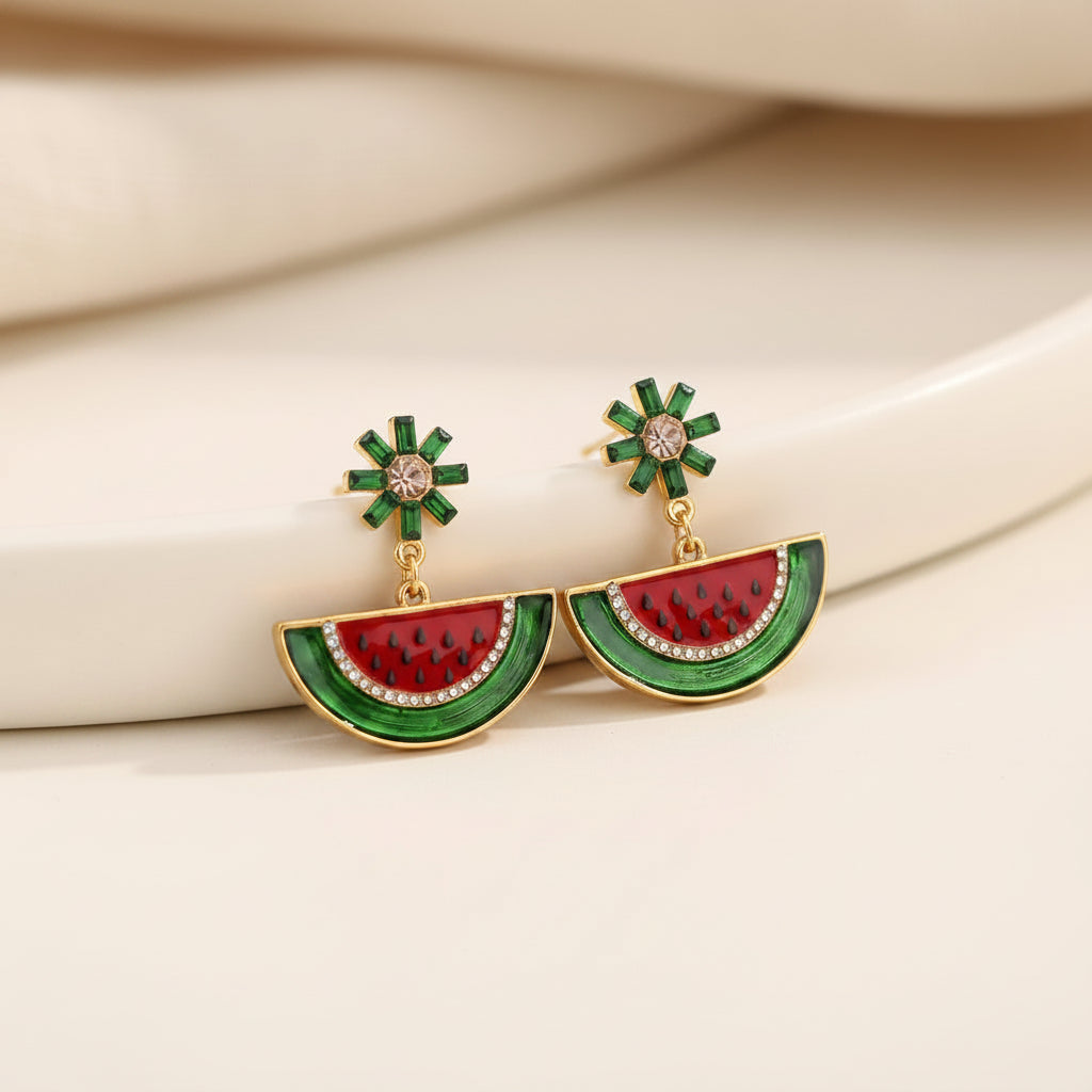 Watermelon Slice Dangle Earrings against a neutral background