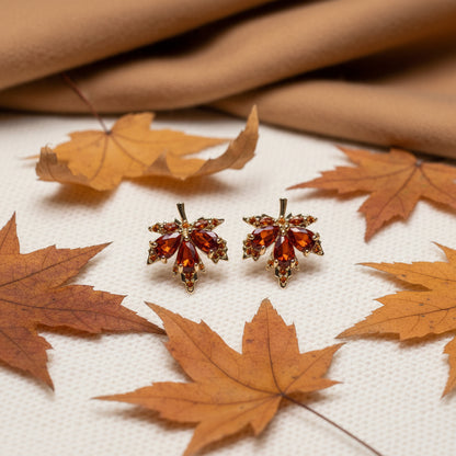Amber Crystal Maple Leaf Earrings on white with leaves
