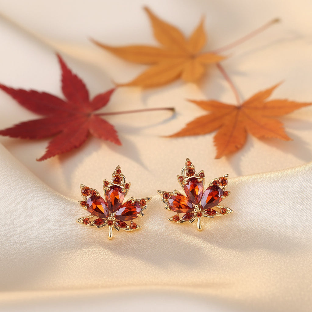 Amber Crystal Maple Leaf Earrings on cream satin with leaves