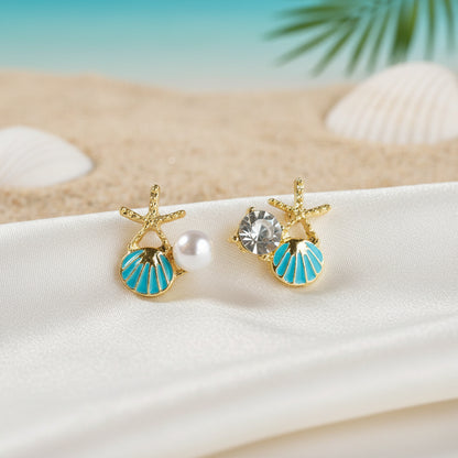 Aqua Shell Pearl & Crystal Starfish Earrings on a beach