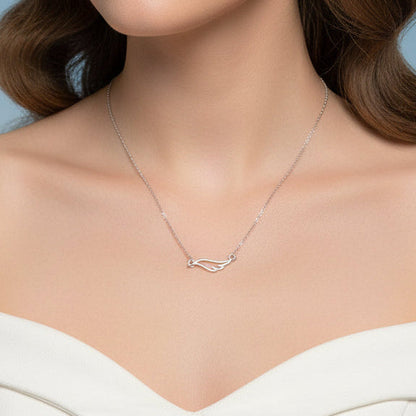 Angel Wing Necklace with a delicate design worn by a model against a neutral background