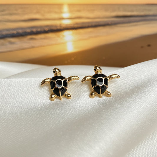 Black & Gold Sea Turtle Earrings at sunset