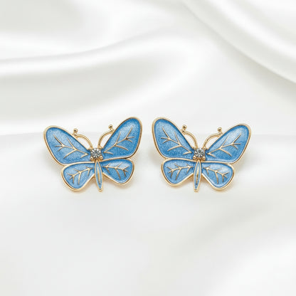 Blue Butterfly Statement Earrings on a white background