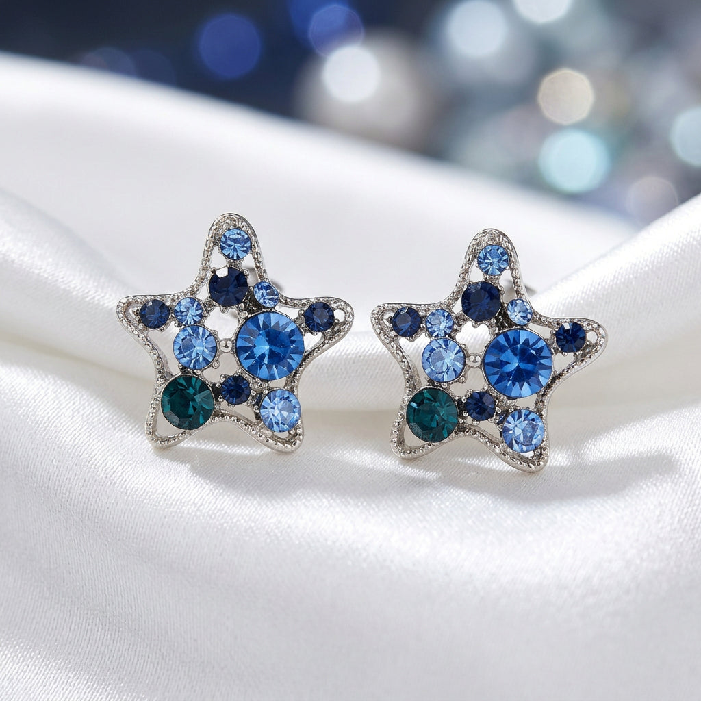 Blue Crystal Star Earrings on white