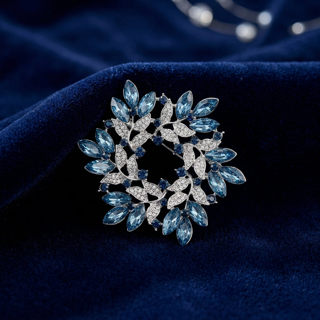 Blue Crystal Wreath Pin on blue velvet