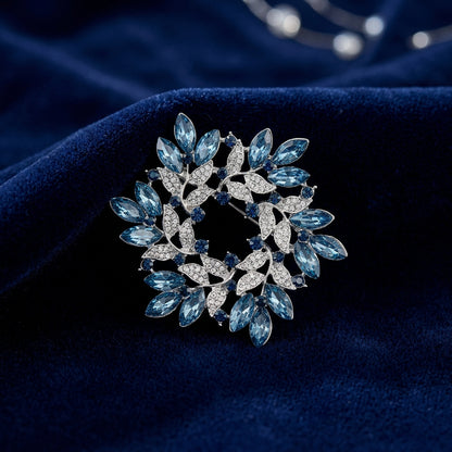 Blue Crystal Wreath Pin on blue velvet