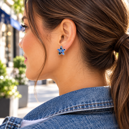 Woman wearing Blue Crystal Star Earrings with blue denim
